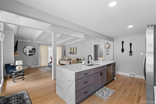 29748 Chelmsford Rd, Southfield, MI 48076 - kitchen with open floor plan, a sink, stainless steel appliances, gray cabinets, and baseboards