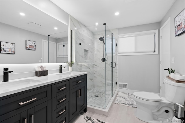 29748 Chelmsford Rd, Southfield, MI 48076 - full bathroom with toilet, recessed lighting, double vanity, a marble finish shower, and baseboards