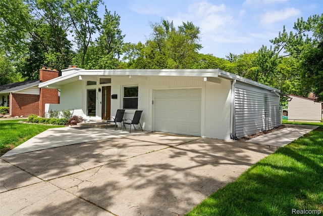 29748 Chelmsford Rd, Southfield, MI 48076 - mid-century home featuring brick siding, a chimney, an attached garage, and driveway