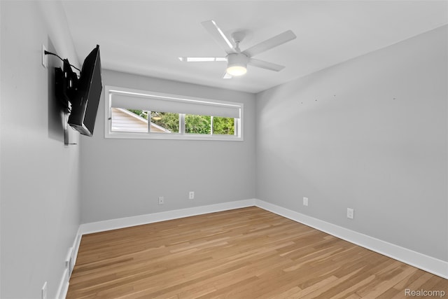 29748 Chelmsford Rd, Southfield, MI 48076 - spare room featuring light wood finished floors, baseboards, and ceiling fan