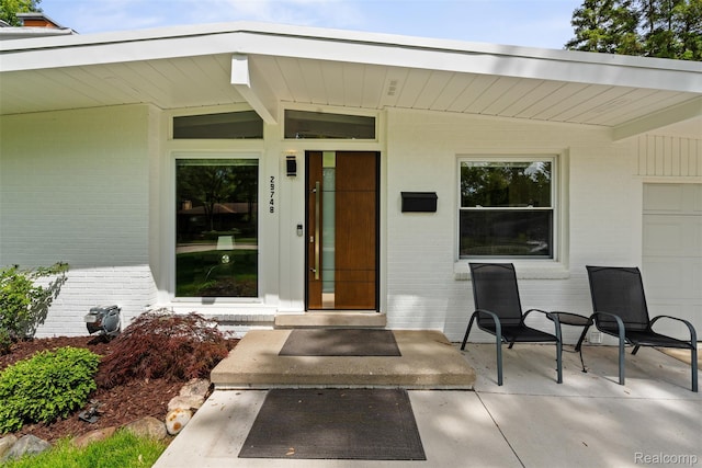 29748 Chelmsford Rd, Southfield, MI 48076 - view of exterior entry featuring brick siding