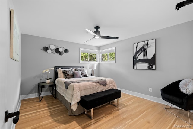 29748 Chelmsford Rd, Southfield, MI 48076 - bedroom with light wood finished floors, baseboards, and ceiling fan