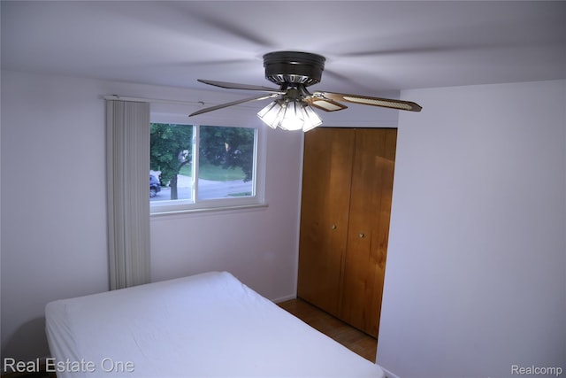18675 Webster Ave, Southfield, MI 48076 - bedroom with a closet, wood finished floors, and ceiling fan