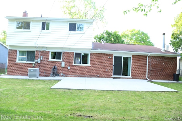 18675 Webster Ave, Southfield, MI 48076 - rear view of property with brick siding, a chimney, and a patio area