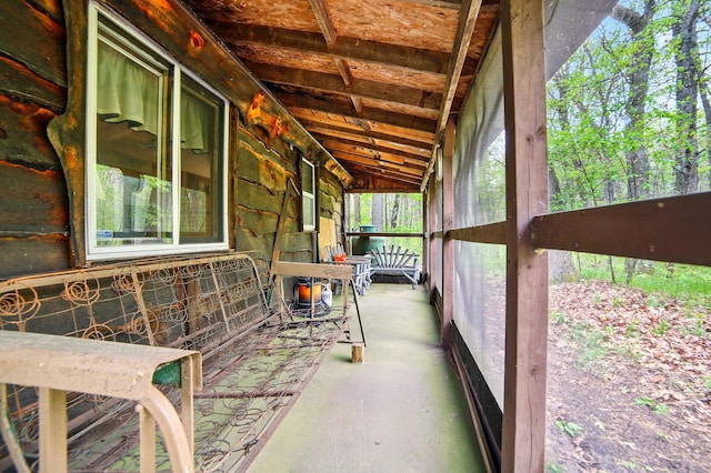 841 W Woodland Park Dr, Bitely, MI 49309 - unfurnished sunroom featuring lofted ceiling