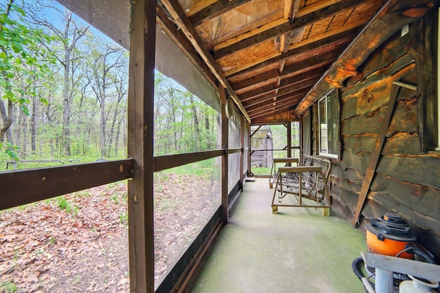 841 W Woodland Park Dr, Bitely, MI 49309 - unfurnished sunroom featuring vaulted ceiling