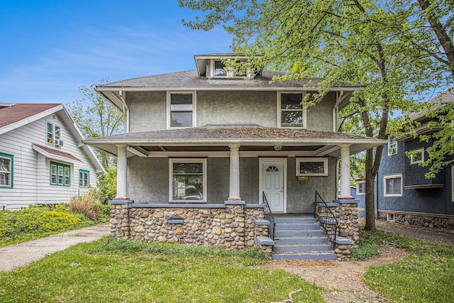 176 N Union St, Battle Creek, MI 49017 - traditional style home with stucco siding, a porch, stone siding, and roof with shingles