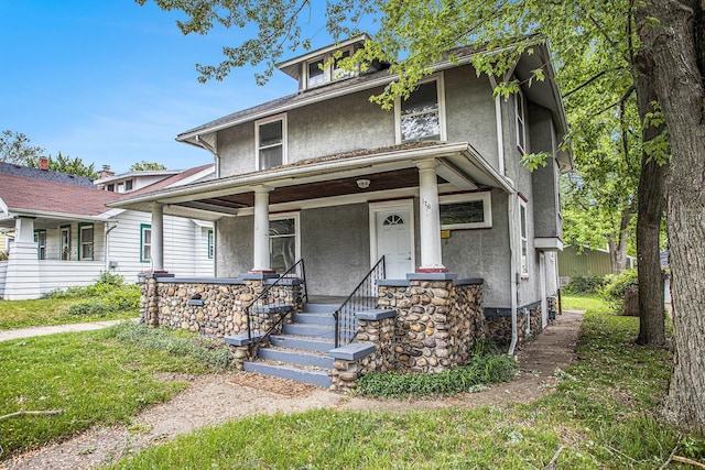 176 N Union St, Battle Creek, MI 49017 - american foursquare style home featuring stucco siding and a porch