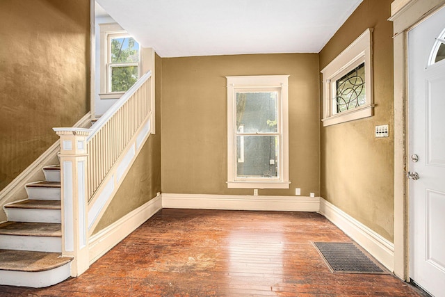 176 N Union St, Battle Creek, MI 49017 - entryway with hardwood / wood-style floors, stairway, and baseboards