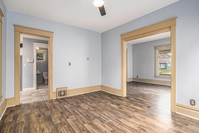 176 N Union St, Battle Creek, MI 49017 - empty room featuring wood finished floors, a ceiling fan, and baseboards