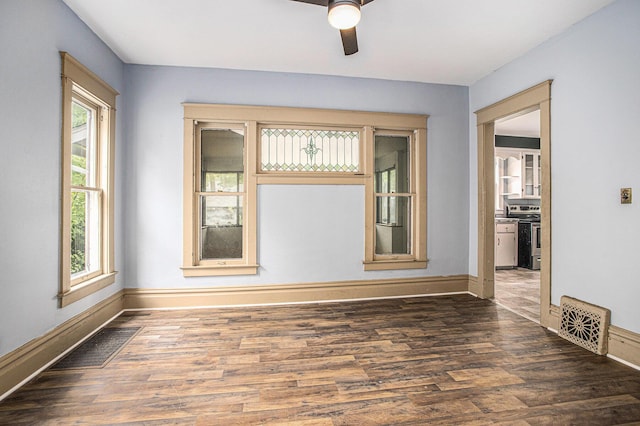 176 N Union St, Battle Creek, MI 49017 - unfurnished room featuring plenty of natural light, baseboards, and wood finished floors