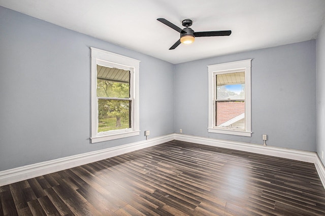 176 N Union St, Battle Creek, MI 49017 - spare room featuring dark wood finished floors, baseboards, and ceiling fan