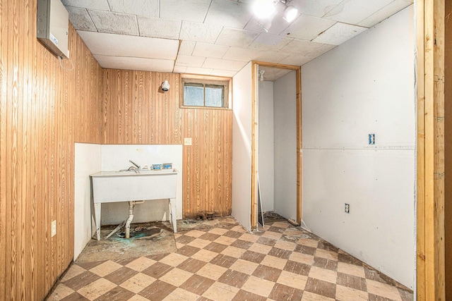 176 N Union St, Battle Creek, MI 49017 - miscellaneous room with light flooring and wood walls
