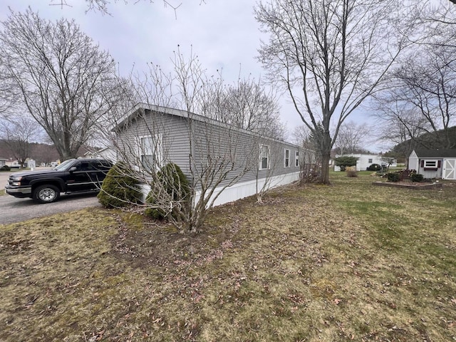 2828 Trepanier Dr Unit 515, Ludington, MI 49431 - view of side of property with an outbuilding