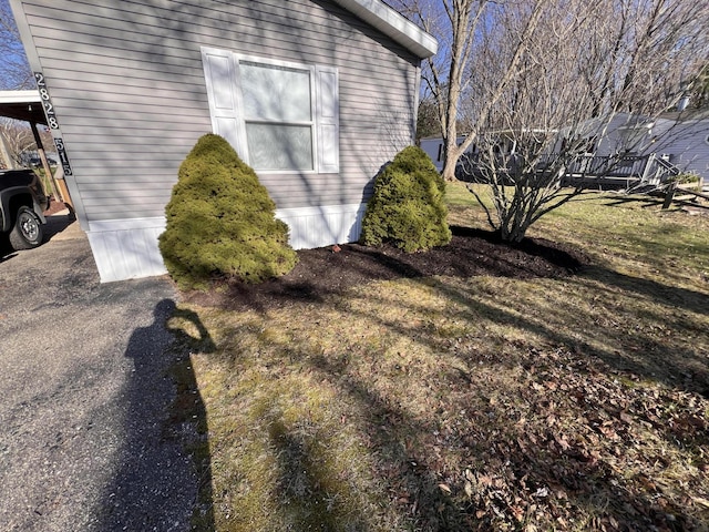 2828 Trepanier Dr Unit 515, Ludington, MI 49431 - view of property exterior featuring a yard