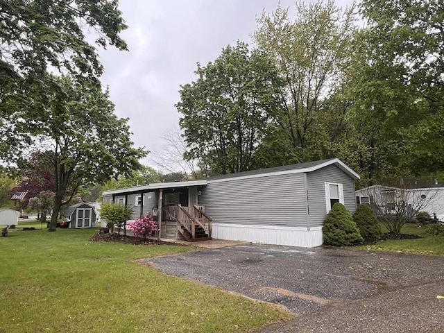 2828 Trepanier Dr Unit 515, Ludington, MI 49431 - manufactured / mobile home with a front lawn and asphalt driveway