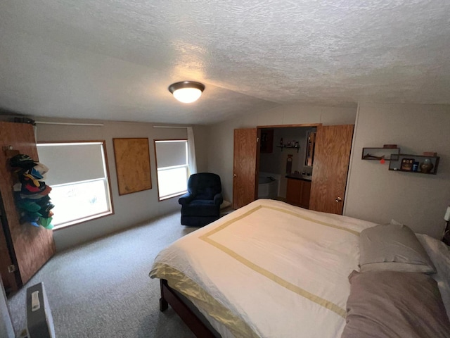 2828 Trepanier Dr Unit 515, Ludington, MI 49431 - bedroom featuring carpet flooring, vaulted ceiling, and a textured ceiling