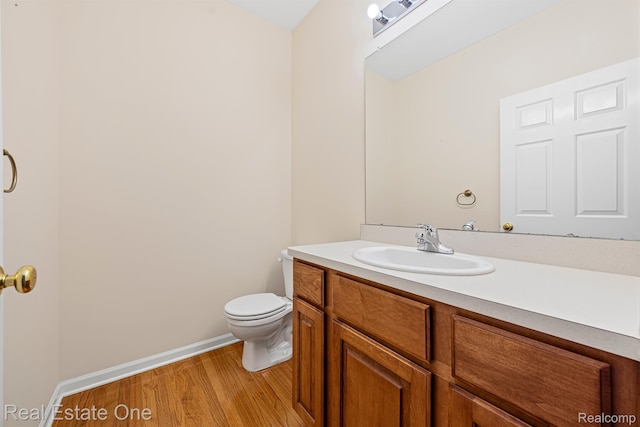 29329 Whistler Dr, Novi, MI 48377 - half bath with wood finished floors, vanity, toilet, and baseboards
