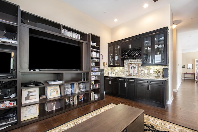 225 N Whittaker St Unit 7 & 8, New Buffalo, MI 49117 - indoor wet bar with decorative backsplash, dark wood finished floors, and baseboards