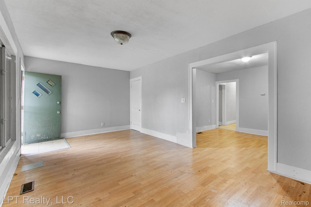 2174 Springle St, Detroit, MI 48215 - spare room with light wood finished floors and baseboards