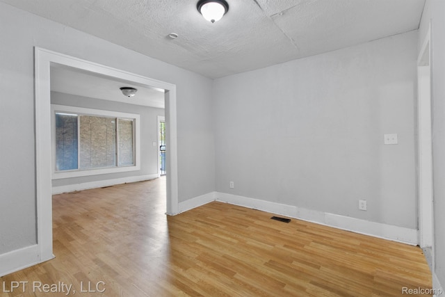 2174 Springle St, Detroit, MI 48215 - empty room featuring wood finished floors and baseboards
