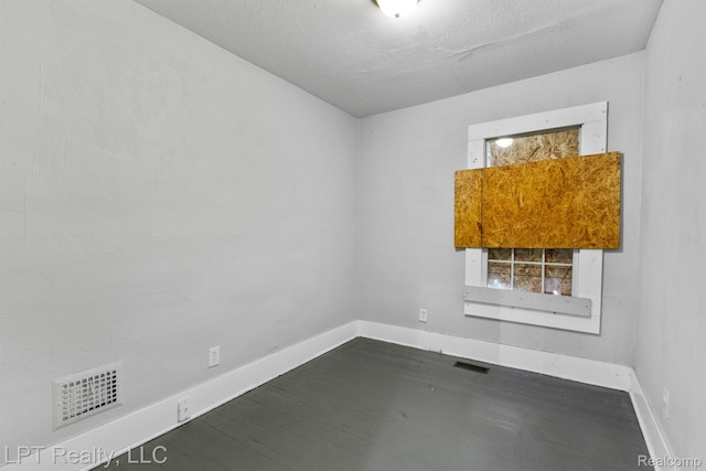 2174 Springle St, Detroit, MI 48215 - unfurnished room featuring baseboards, wood finished floors, and healthy amount of natural light
