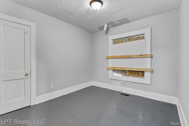 2174 Springle St, Detroit, MI 48215 - empty room with dark wood-style flooring and baseboards