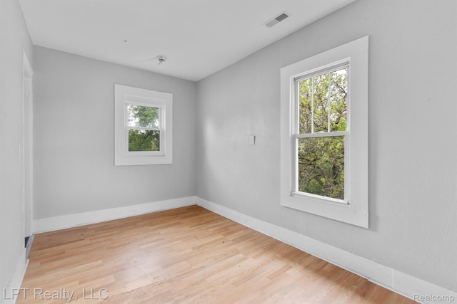2174 Springle St, Detroit, MI 48215 - spare room featuring healthy amount of natural light, light wood-style floors, and baseboards