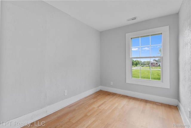 2174 Springle St, Detroit, MI 48215 - empty room with wood finished floors and baseboards