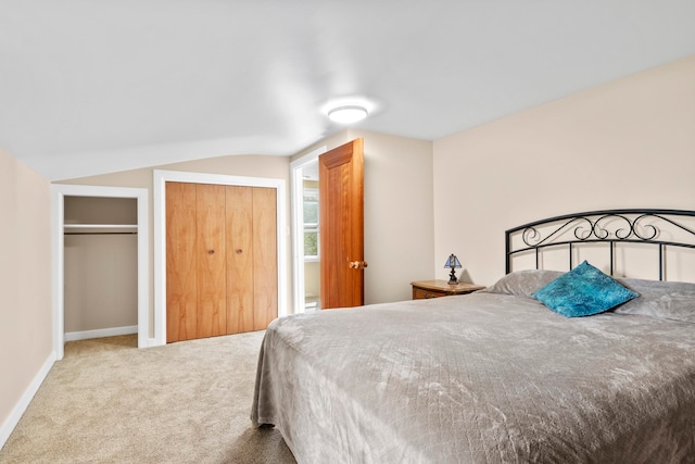 7256 Highland Dr, Beulah, MI 49617 - bedroom featuring carpet flooring, two closets, baseboards, and lofted ceiling