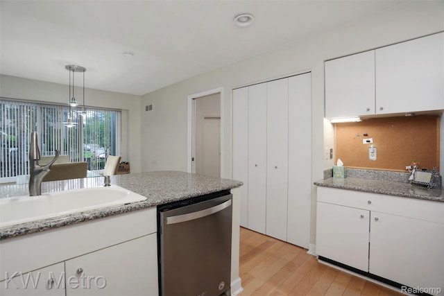 7273 Creeks Bend Ct, West Bloomfield, MI 48322 - kitchen with stainless steel dishwasher, a sink, light wood finished floors, white cabinetry, and hanging light fixtures
