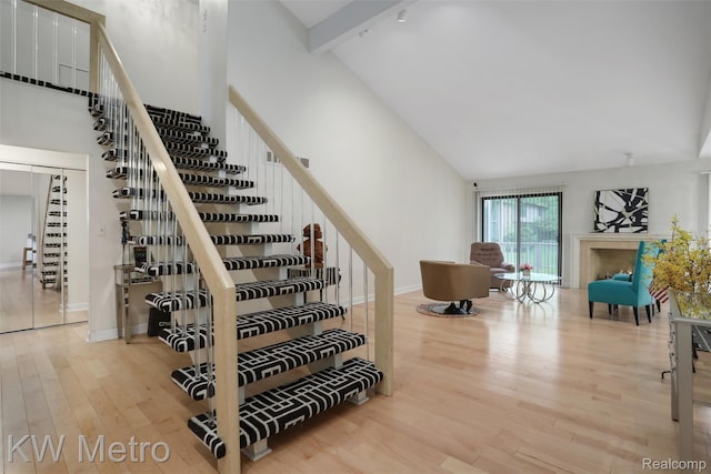 7273 Creeks Bend Ct, West Bloomfield, MI 48322 - stairway featuring high vaulted ceiling, wood finished floors, baseboards, and beam ceiling