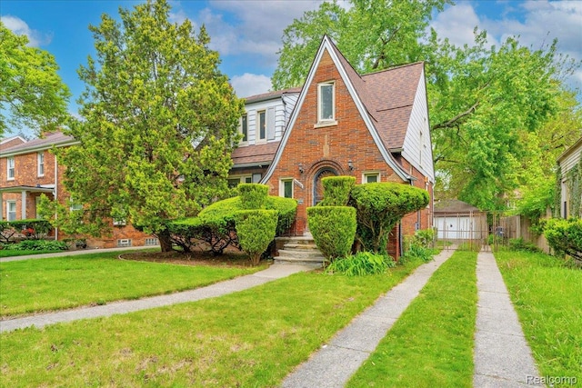 14004 Abington Ave, Detroit, MI 48227 - tudor home with brick siding and a garage