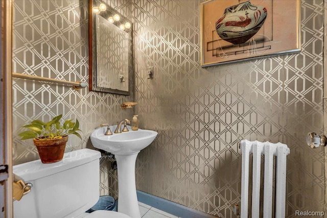 14004 Abington Ave, Detroit, MI 48227 - bathroom featuring radiator heating unit, toilet, and tile patterned floors