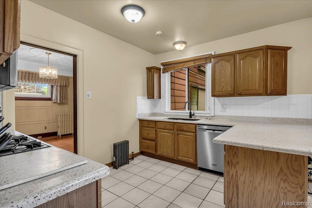 14004 Abington Ave, Detroit, MI 48227 - kitchen featuring dishwasher, radiator heating unit, a sink, light countertops, and brown cabinets