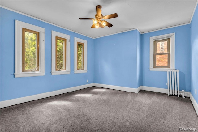 14004 Abington Ave, Detroit, MI 48227 - unfurnished room with radiator, crown molding, carpet flooring, baseboards, and ceiling fan