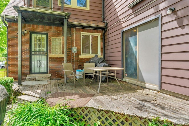14004 Abington Ave, Detroit, MI 48227 - property entrance featuring a wooden deck and brick siding