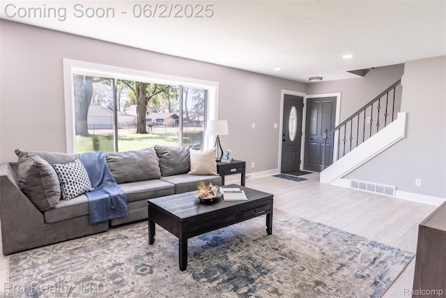 2750 Lansdowne Rd, Waterford, MI 48329 - living room featuring baseboards, wood finished floors, stairs, and recessed lighting