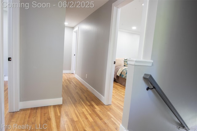 2750 Lansdowne Rd, Waterford, MI 48329 - hallway with an upstairs landing, light wood-style floors, baseboards, and recessed lighting