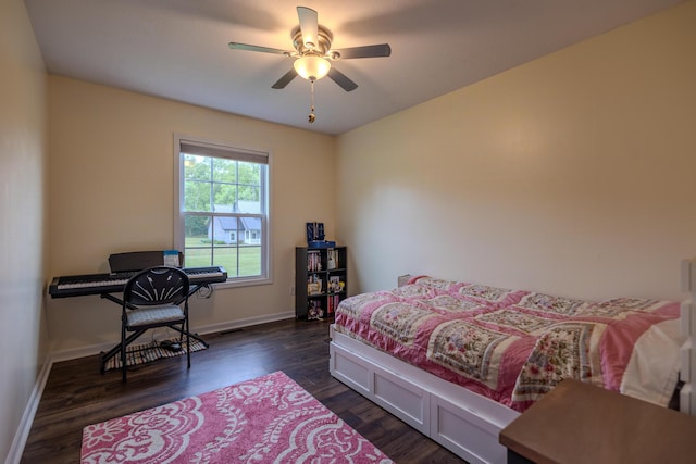 6573 Sweet Clover Hills Dr, Jonesville, MI 49250 - bedroom with baseboards, dark wood-style flooring, and a ceiling fan