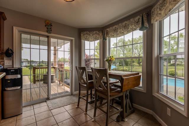 6573 Sweet Clover Hills Dr, Jonesville, MI 49250 - sunroom / solarium with tile patterned floors and baseboards