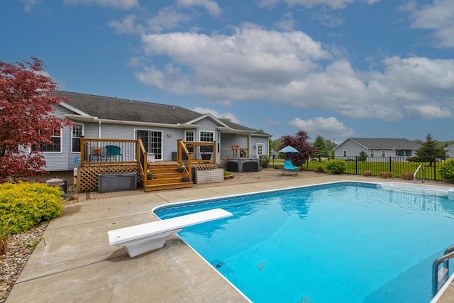 6573 Sweet Clover Hills Dr, Jonesville, MI 49250 - view of swimming pool featuring a deck, a diving board, and a patio