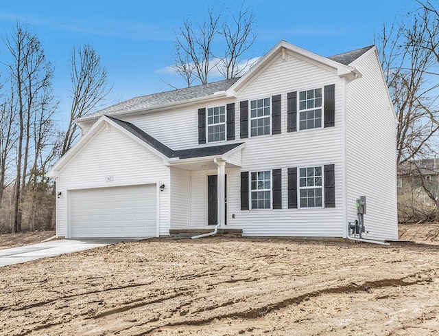 6129 Pollys Path, Berrien Springs, MI 49103 - traditional-style house featuring driveway, a garage, and roof with shingles