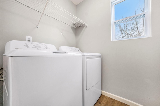 6129 Pollys Path, Berrien Springs, MI 49103 - laundry room with washing machine and clothes dryer, wood finished floors, and baseboards