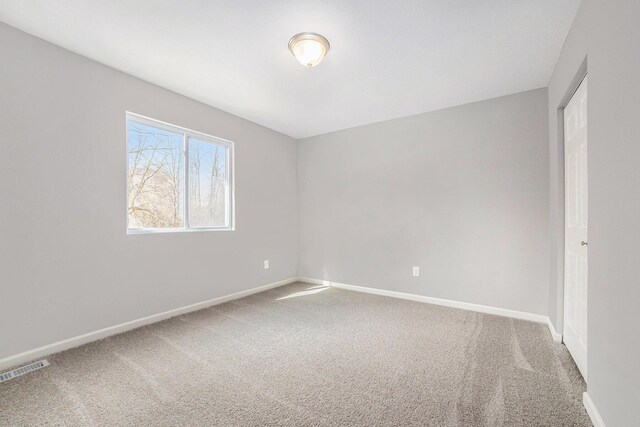 6129 Pollys Path, Berrien Springs, MI 49103 - spare room with carpet and baseboards