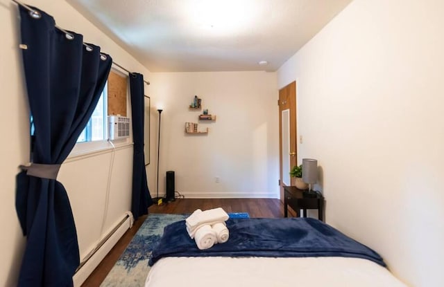 116/118 Glendale Dr, Ann Arbor, MI 48103 - bedroom featuring a baseboard radiator, wood finished floors, and baseboards