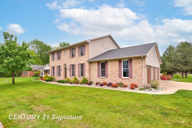 3803 Prairie Creek St, Saginaw, MI 48603 - colonial home featuring brick siding, driveway, and a front lawn