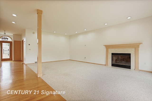 3803 Prairie Creek St, Saginaw, MI 48603 - unfurnished living room with wood finished floors, a fireplace, recessed lighting, and baseboards