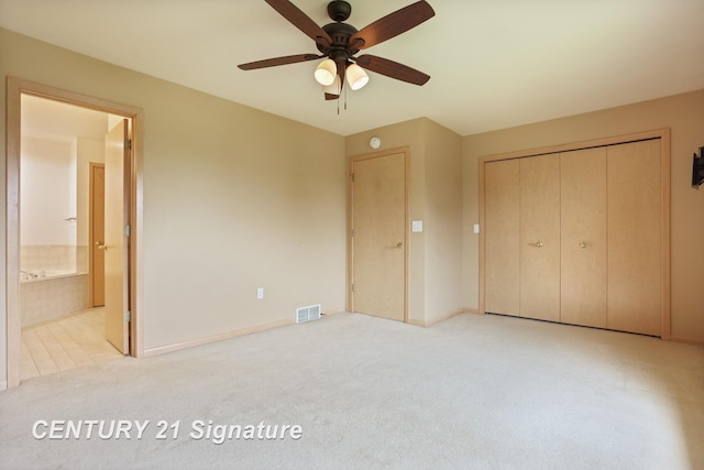 3803 Prairie Creek St, Saginaw, MI 48603 - unfurnished bedroom featuring carpet floors, a closet, baseboards, connected bathroom, and ceiling fan