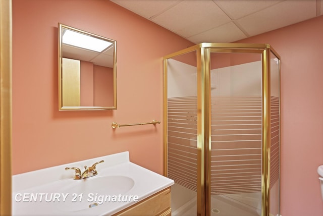 3803 Prairie Creek St, Saginaw, MI 48603 - bathroom with a stall shower, a drop ceiling, vanity, and toilet